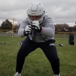 Griffin Empey (10) prepares for a defensive drill during a contact day