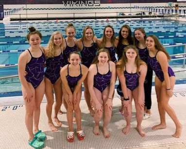 Schaefer (bottom middle) and Borroughs (third from the top right) pose with their other teammates last season. 