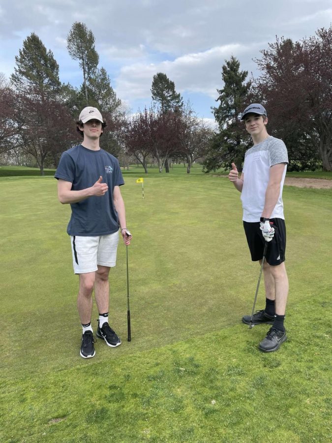 Beck Sisler (11) and Zack Bonebright (11) pose at the Stoughton Country Club. Photo from Beck Sisler.
