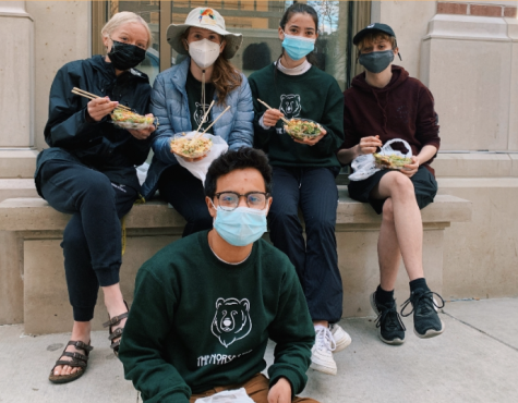 Norse Star seniors in a Madison alley enjoying their poke bowls.