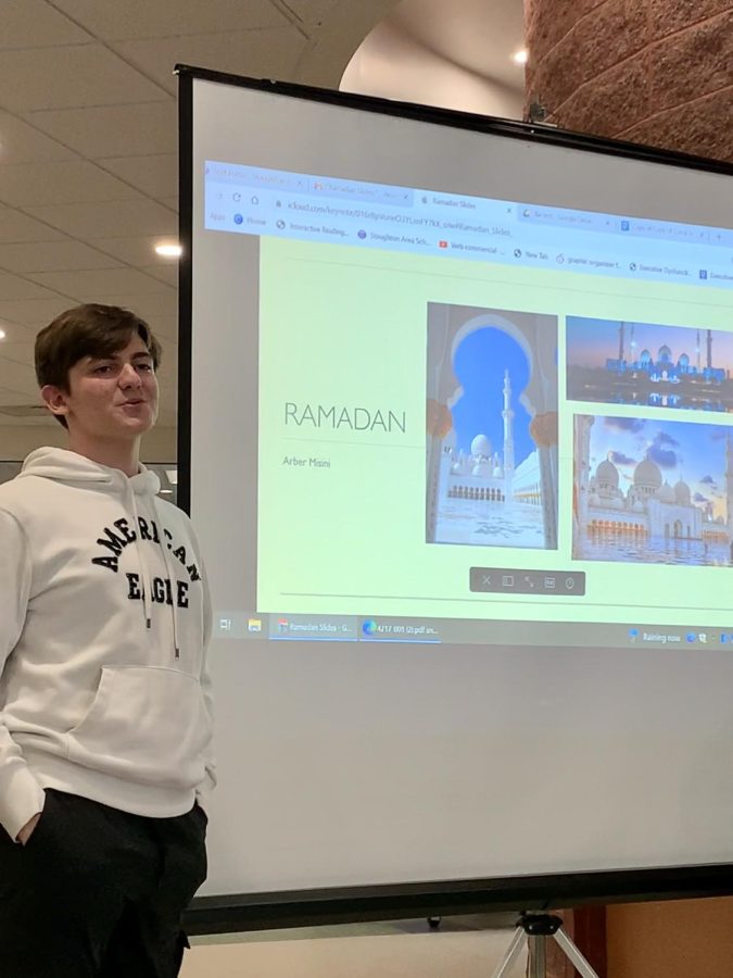 Junior Arber Misini gives a presentation to The Undivided about the upcoming Islamic holiday, Ramadan.