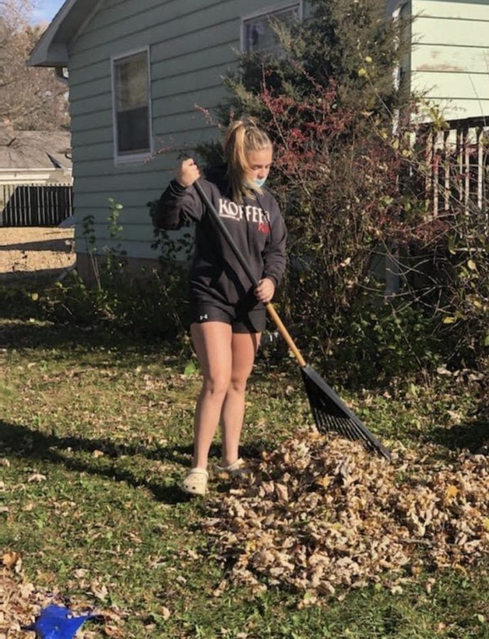 Huchthausen spends an afternoon raking leaves at a senior citizens home in the fall of 2021.