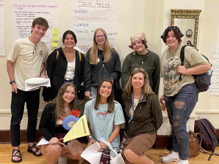 Environmental+Club+students+posing+at+the+Stoughton+Sustainability+Community+Dialogue+on+Wednesday%2C+Sept.+21.+%0ABack+row+left+to+right%3A+Patrick+Lions%2C+Lily+LaPointe%2C+Kristina+Weber%2C+Ren+Gletty+Syoen%2C+Lily+O%E2%80%99Hearn.%0AFront+row+left+to+right%3A+Lizzy+Wacker%2C+Megan+Blommel%2C+Rebecca+Murphy