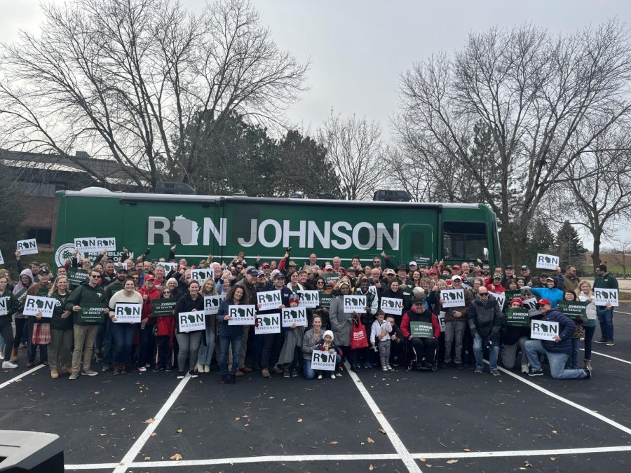 Supporters take a photo with Senator Johnson at a campaign stop in Middleton.