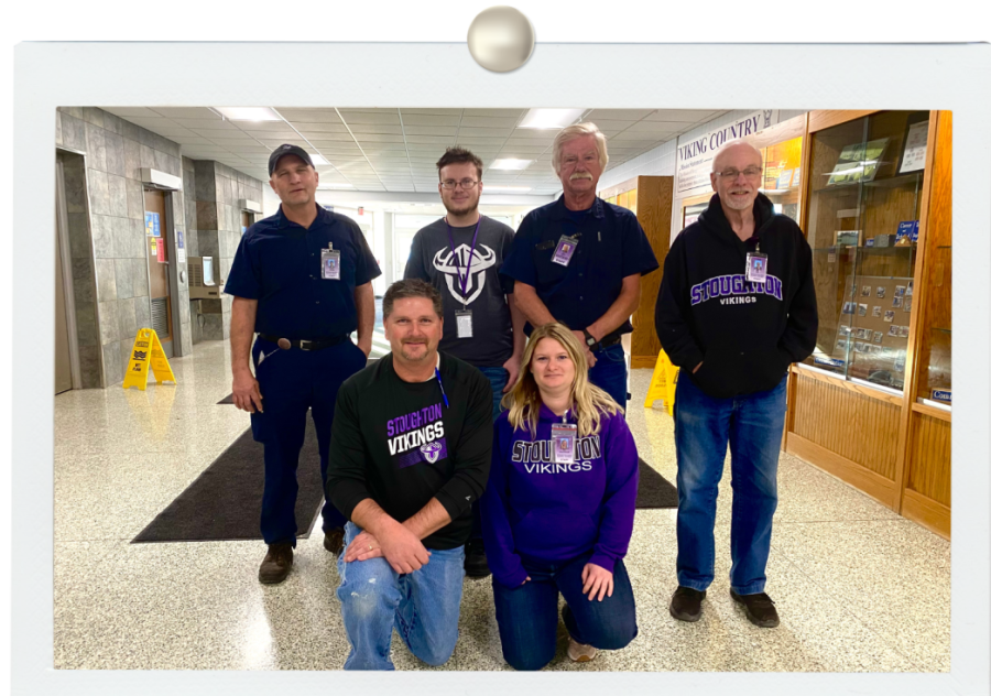 Pope (bottom left) and Piper (top  right) pose with some of the custodial staff in exhibition hall. During the summer, custodians from every school in SASD come together to deep clean all of the schools before the new school year starts.