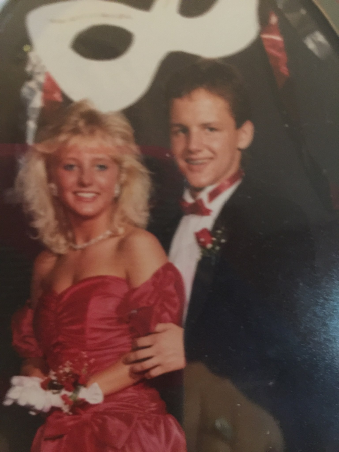 Jason and Susan Model pose for a photo, during a high school dance.