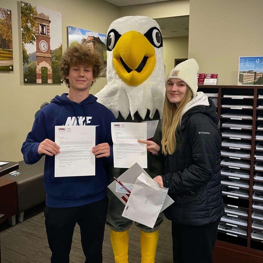 Photo submitted by Luke Thorson.
Seniors Luke Thorson and Emma Anderson pose         with their acceptance letters while touring                  UW-La Crosse.