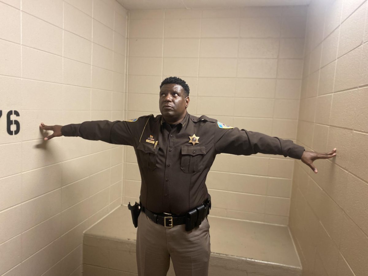 Dane County Sheriff Kalvin Barret poses in cell at the Dane County Public Safety Building 