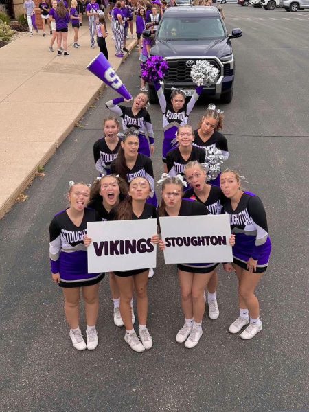 The cheerleaders show their spirit before the Homecoming game
