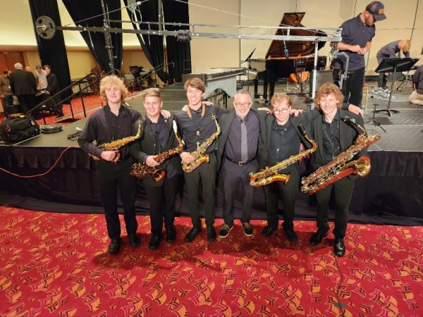 Andrew Scott (far left) stands posed with the five other saxophonists in the WSMA
State Ensemble, at the Monona Terrace.