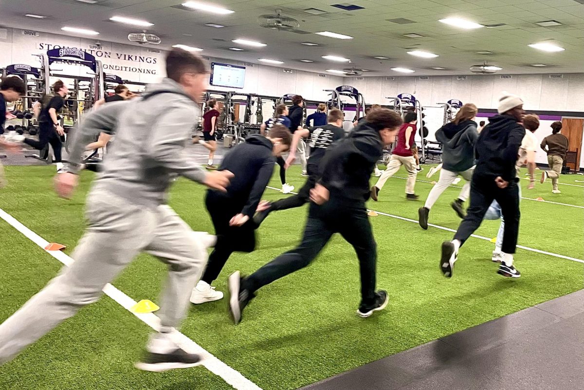 A strength class warming up for exercise.